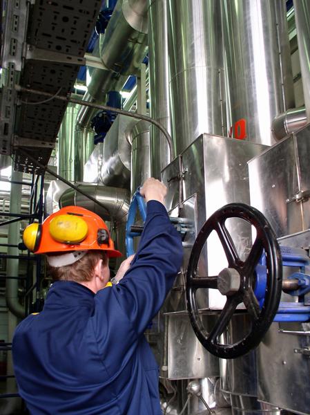 Stock Image- pipelines and engineer refinery