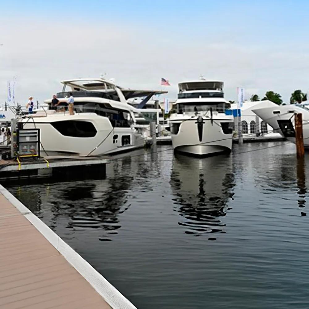 Several white boats near the wooden dock.