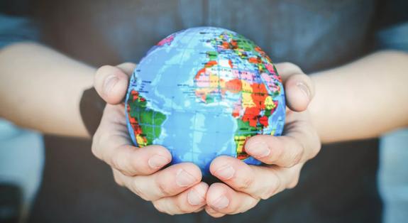Protect our world in human hands. Human hands holding Green planet , Save earth concept.