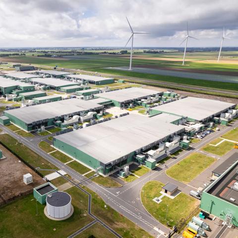 Horizontal color image of a data center from a drone point of view.