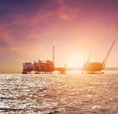 Offshore construction platform for production oil and gas in gulf of Thailand with sunset sky