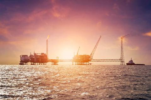 Offshore construction platform for production oil and gas in gulf of Thailand with sunset sky