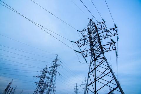 Ground-view of several transmission towers.