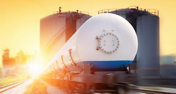 A white pipeline with two towers behind it