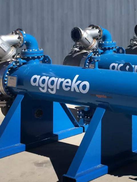 Blue Aggreko heat exchanger outdoors.