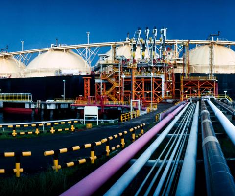 Stock Image- LNG Tanker loading Liquified Natural Gas at Asian liquefaction plant.