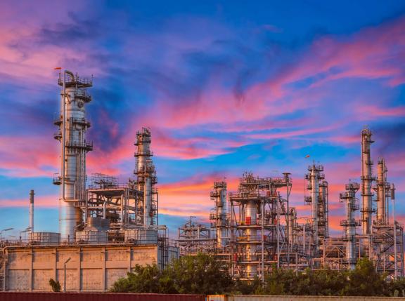 Oil Refinery with tube and oil tank along twilight at beautiful, Refinary plant with oil tank storage, Petrochemical plant, Chemical Plant at sunset