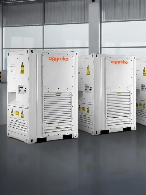 Aggreko industrial units lined up indoors.