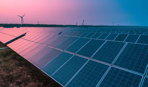 Solar panels with wind turbines on a sunny day,green clean energy concept