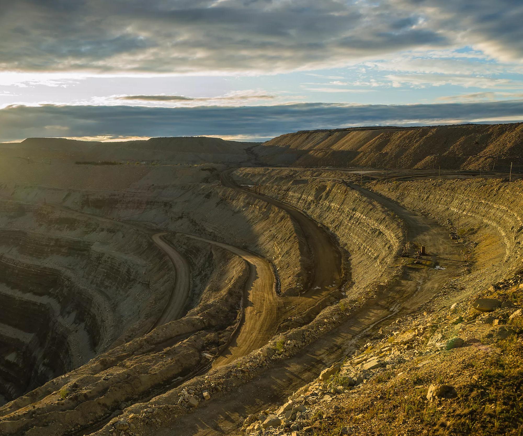Aerial view of a large mining site in a mountainous landscape