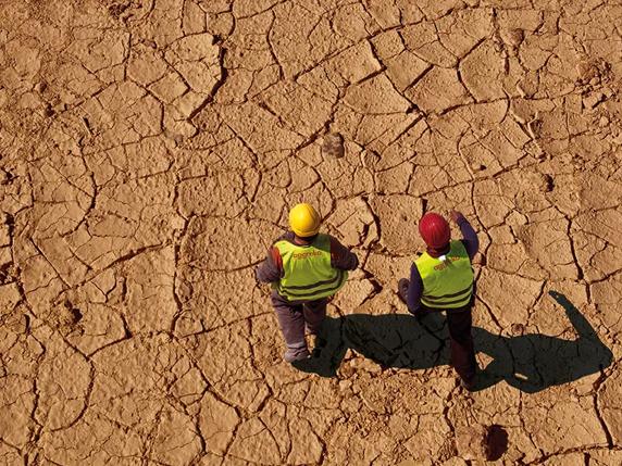 Men walking on desert