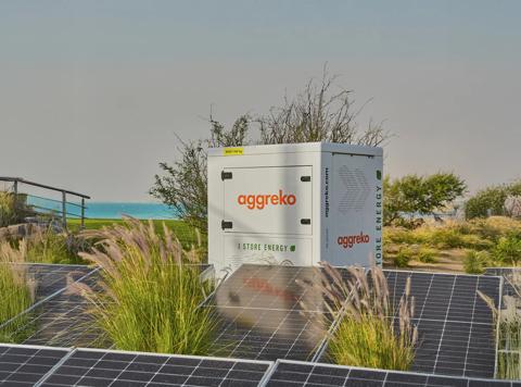 White Aggreko battery sitting outdoors.