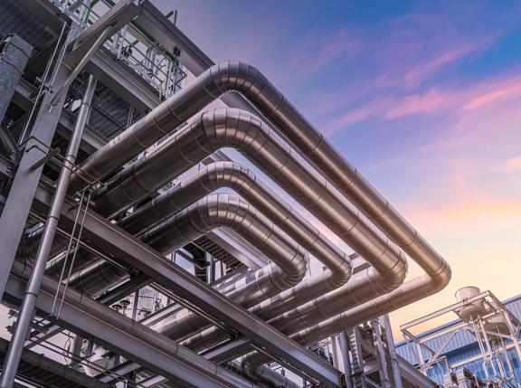 pipeline of oil and gas at industry zone.The pipe of factory ,Close-up of industrial steel pipelines at oil-refinery plant and sky