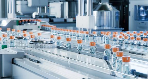Advanced Bright Modern Pharmaceutical Factory. Medical Ampoule Production Line. Rows of Glass Vials with Orange Caps on Conveyor Belt. Vaccine Production Facility. Medication Manufacturing Process.