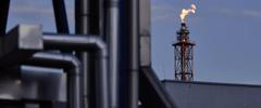 Flames from a flare stack at an oil refinery in Poland. Photographer: Bartek Sadowski/Bloomberg