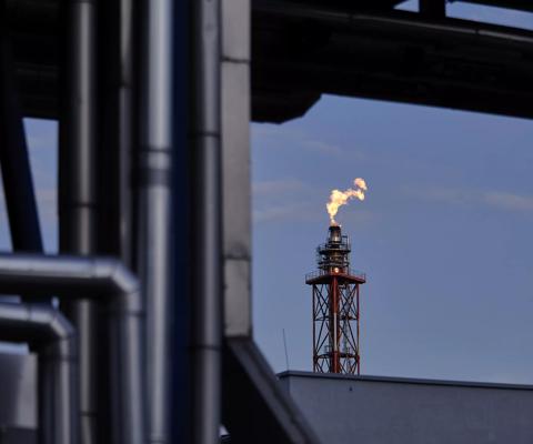 Flames from a flare stack at an oil refinery in Poland. Photographer: Bartek Sadowski/Bloomberg