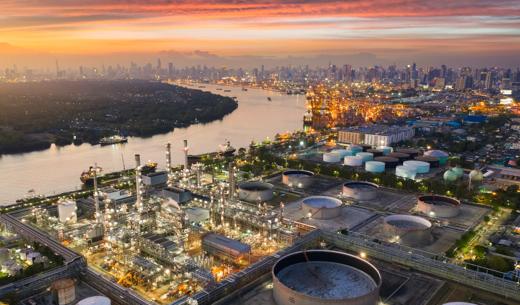 Aerial view oil and gas industrial, Refinery factory oil storage tank and pipeline steel at sunset