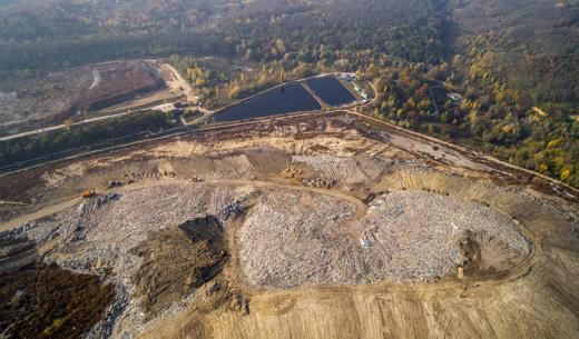 Aerial view of the big city dump. Smog formed in the sky.