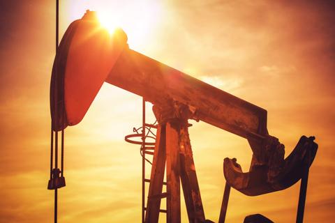 Oil Pump on California Prairie. Scenic Industrial Sunset. Oil Industry Theme with Pumping Unit.