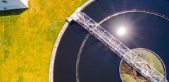 Aerial view to sewage treatment plant. Grey water recycling. Waste management in European Union.  Environmentally theme.