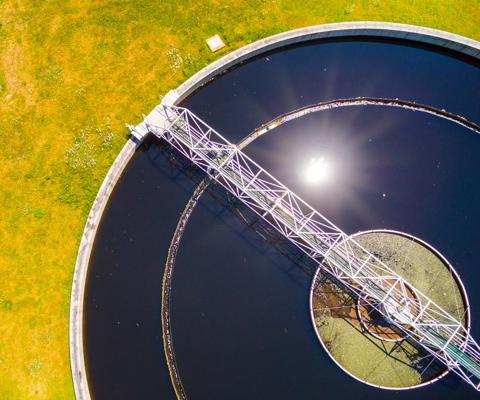 Aerial view to sewage treatment plant. Grey water recycling. Waste management in European Union.  Environmentally theme.