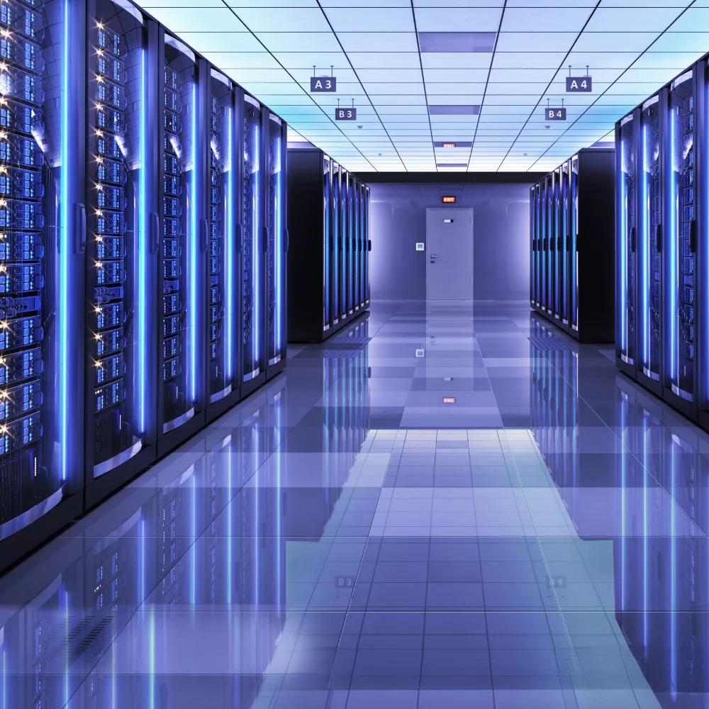 Hallway with glass and blue lights inside a data center