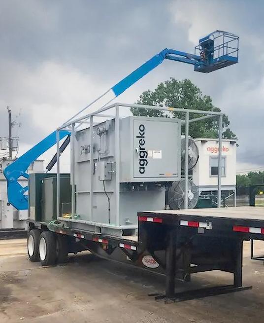 A grey trailer-mounted Aggreko mobile substation at a worksite