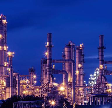 View of a petrochemical refinery plant at night.
