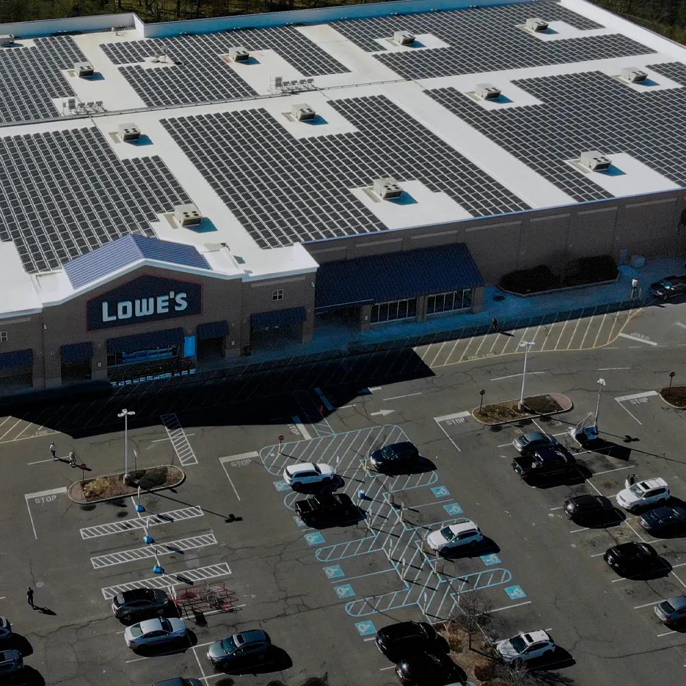 An aerial panoramic view of a large, single-story commercial or retail building.  
