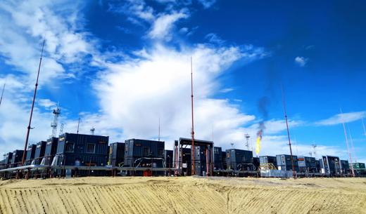 Flare gas project, gas containers with blue sky and flare in background