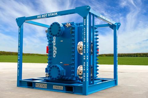 A large, blue Aggreko plate heat exchanger encased in a square, blue steel lifting frame. The frame has "DO NOT STACK" and lifting instructions painted on it.