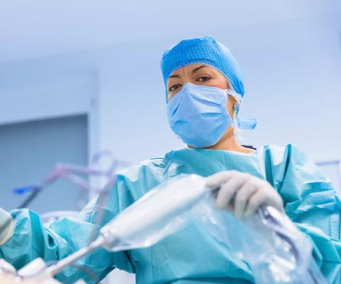 Surgeons performing surgery in operating Theater.