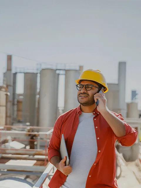 Mechanical contractor stands among units at a job site