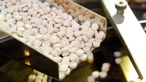 2009Jun-stock-medicine-tablet-pill-production-rails-closeup-pharmaceuticals