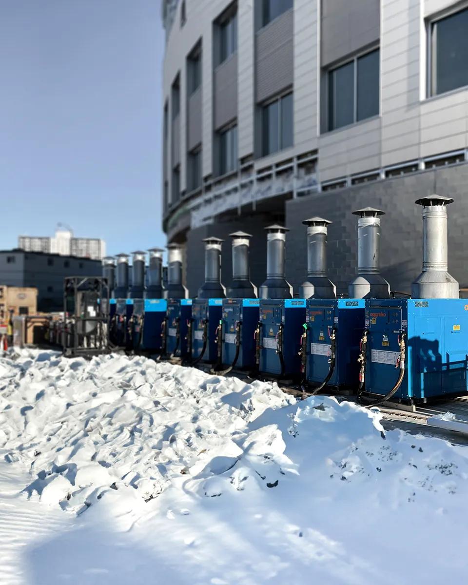 Aggreko heaters placed outside a facility.