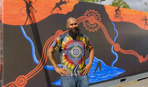 Local artist Leeton Lee creates art on 20ft generator container Gold Coast 2018 Commonwealth Games