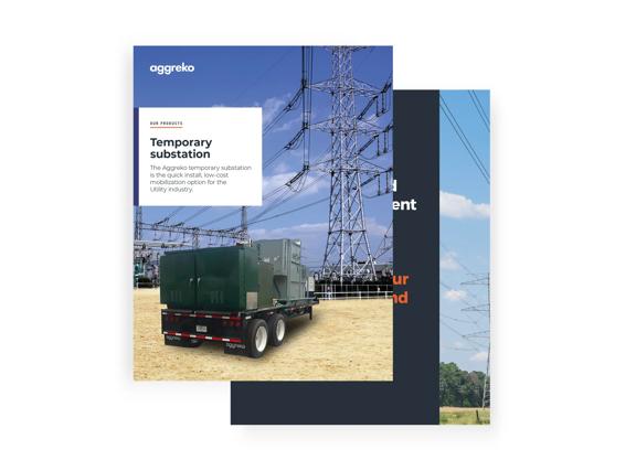 A mobile substation on a trailer, positioned in front of high-voltage power lines and electrical infrastructure.