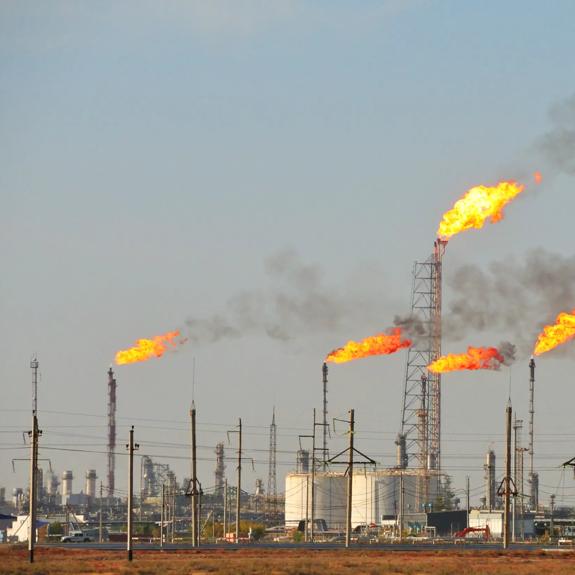 Gas flaring at an oil refinery.