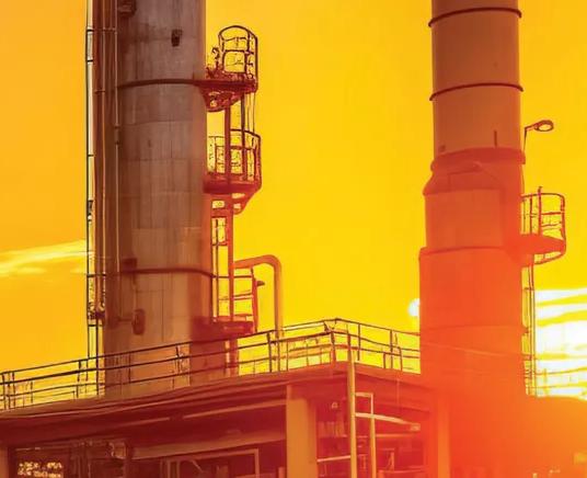 View of a petrochemical plant during sunset.