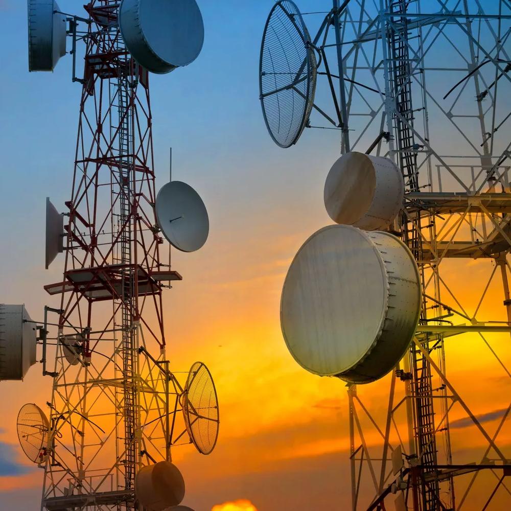 Closeup of a telecommunications tower during sunset.