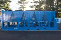 A large blue air cooled fluid chiller with multiple cooling units.