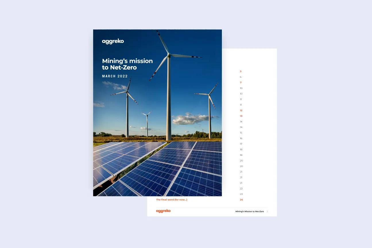 A brochure titled Minings mission to Net Zero features solar panels and wind turbines against a blue sky.