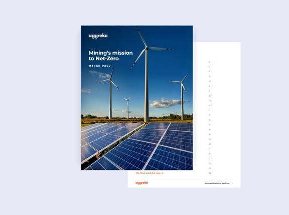 A brochure titled Minings mission to Net Zero features solar panels and wind turbines against a blue sky.