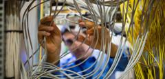 2017Jan-stock-technician-fixing-cable-computer-data_centres