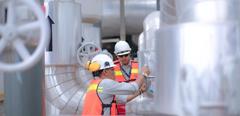 an Asian engineer conduct process safety inspection