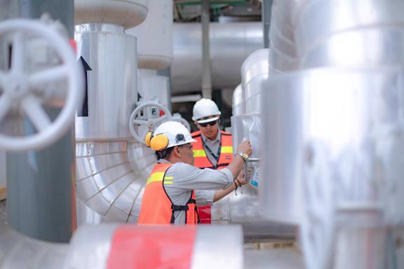 an Asian engineer conduct process safety inspection