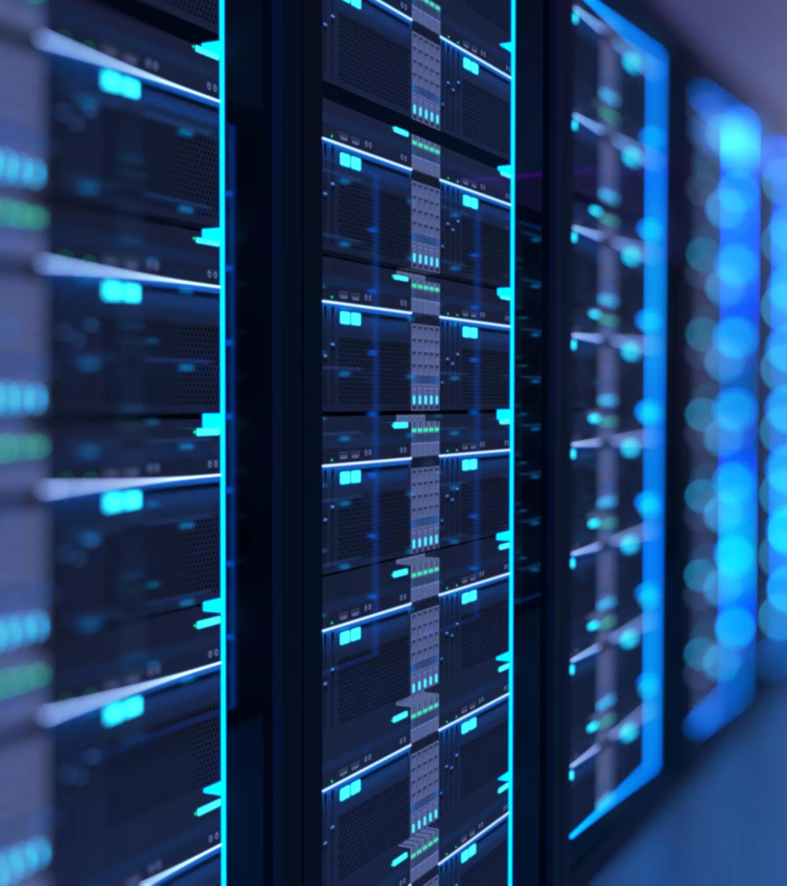 A dark, shallow-focus shot on a row of server racks, with numerous small, glowing blue lights and digital readouts on the server faces.