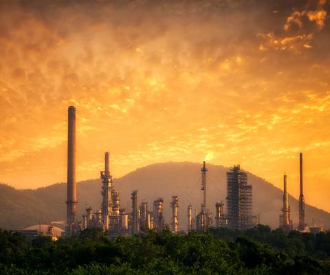 Oil refinery at sunset