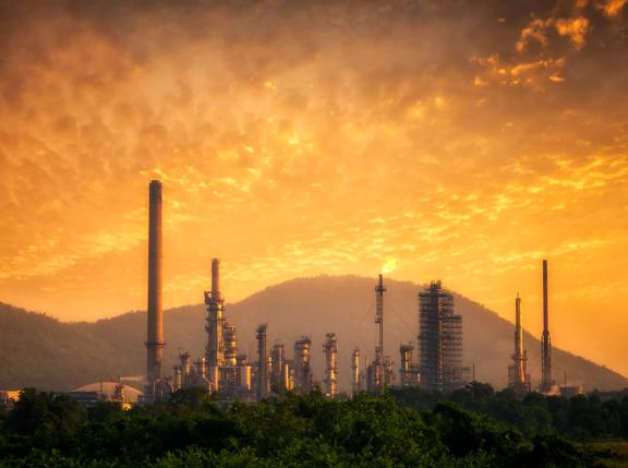 Oil refinery at sunset