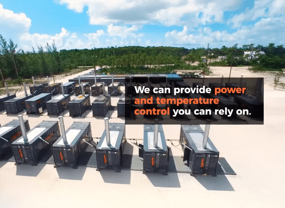Multiple rows of black Aggreko HVAC units are placed outdoors.